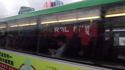 Street View from Bus Window, Bus Stop, Skyscrapers, Kowloon, Hong Kong Stock Footage 344408833