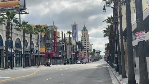 Street view down an empty Hollywood Blvd in LA during corona virus lockdown Stock Footage 133826386