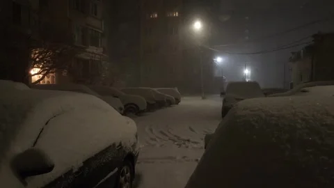 Street view front backyard of the building snowfall Stock Footage 256990394