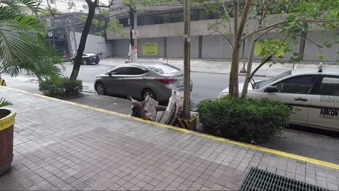 Street View, Lying Man Reads Paper, Manila, Luzon, Philippines Stock Footage 230207397