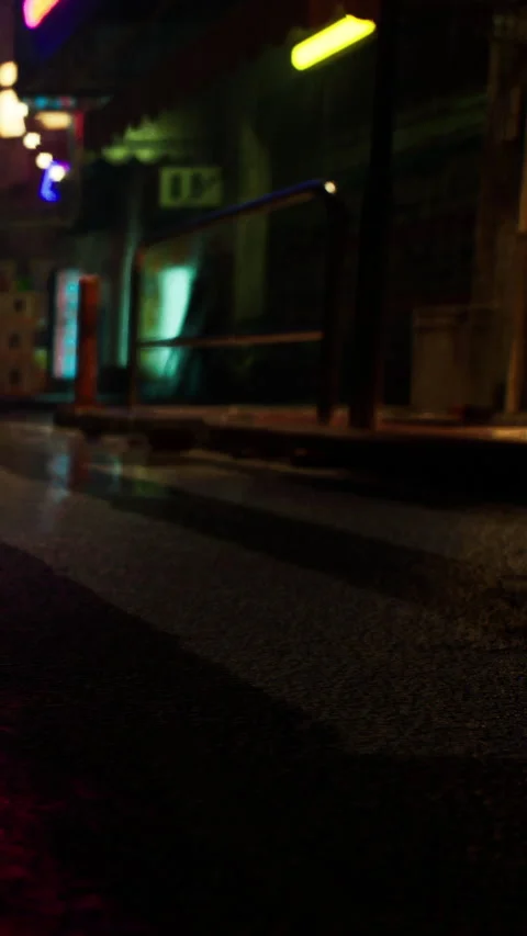 Street view at night showing reflections and neon lights in a city Stock Footage 338352903