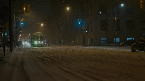 Streetcar passing by during snowfall Video stock 104018729