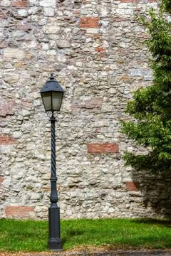Streetlight on the background of the wall. Stock Photos