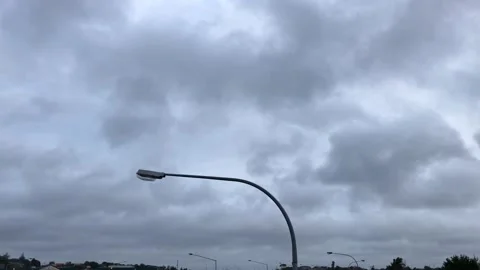 Streetlight under dark rain clouds Video stock 184328663