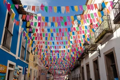Streets and houses of Pelourinho decorated with colorful flags for the feas.. Stock Photos