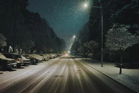 The streets of the city of Cacak while the first snow falls 스톡 사진
