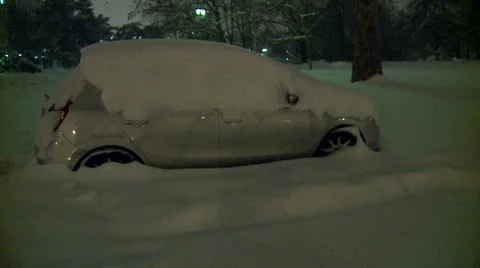 Streets covered with snow during the night, parked car 6 Video stock 10820191