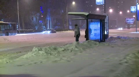 Streets covered with snow during the night, bus stop Stock Footage 10820393