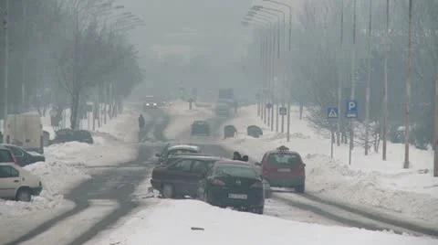 Streets covered with snow, traffic Video stock 10820997