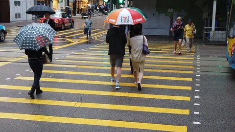 Streets crowded with people shopping at the raining day Stock Footage 125217455