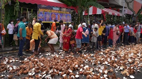 Streets filled with smashed coconuts during Thaipusam celebration. Stock-Footage 318090959