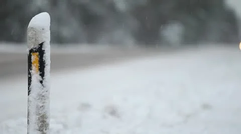 Streetside pole in snowfall Stock Footage 10574633