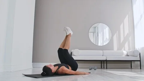 Strength training body weight workout woman athlete doing Flutter Kicks Stock Footage 116554391
