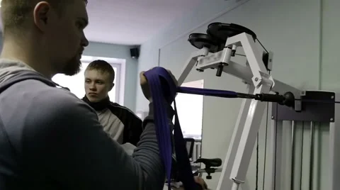 Strength training in the gym on simulators Stock Footage 62365694