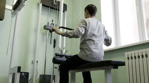 Strength training in the gym on simulators Stock Footage 62366388