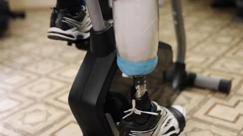 Strength training, Prosthetic routine, Exercise adaptation Stock-Footage 272507263