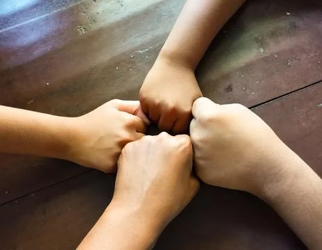Strength in Unity A Circle of Fists Stock Photos