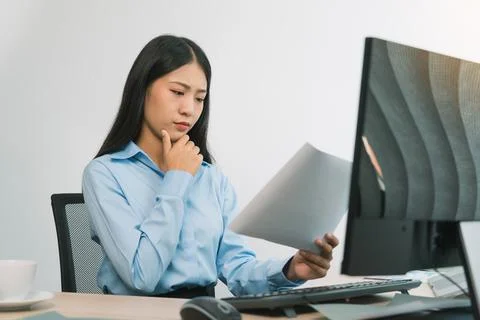 Stress asian woman while coding data programmer on desktop PC while working.. Stock Photos
