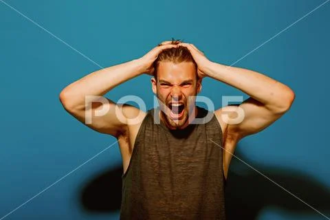 Stress concept. Stressed man pull out hair on head of stress. Handsome man shout Stock Photos