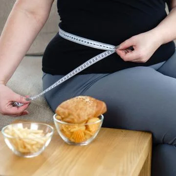 Stress, eating problems, compulsive overeating, weight gain. overweight woman Stock Photos