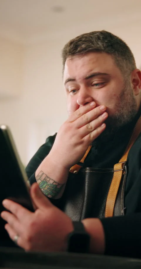 Stress, man and chef with tablet in house for cooking with recipe on mobile food Stock Footage 306878980