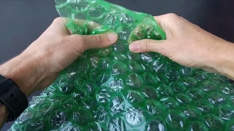 Stress relief bubble wrap popping Stock Footage 80136191