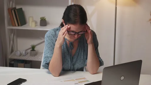 Stress tension work headache sick female employee Stock Footage 183253566