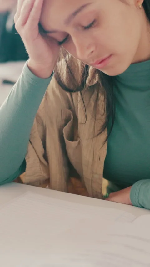 Stress, thinking and test with student in classroom for academic pressure, tired Stock Footage 332987459