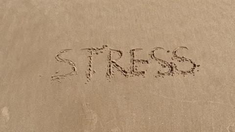"Stress" word is written on the beach 動画素材 239688044