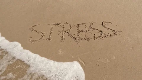 "Stress" word is written on the beach 動画素材 239690034
