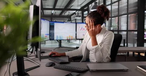Stressed Accountant Analyzing Financial Data On Computer Screen In Office. Stockfoto's