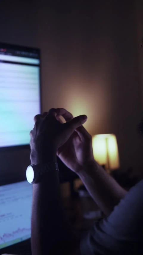 Stressed analyst working late overtime at night Stock Footage 327308032