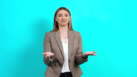 Stressed, angry young brown-haired woman in a business jacket Stock Footage 141499548
