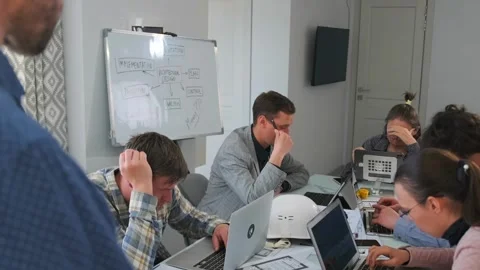 Stressed architects under pressure as manager criticizes blueprint errors Stock-Footage 316045142