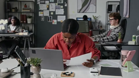 Stressed Black Female Programmer Closing Laptop in Modern Workspace Stock-Footage 336712514