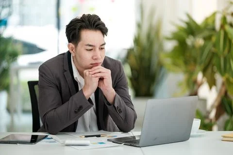 Stressed business man working in the office. Stock Photos