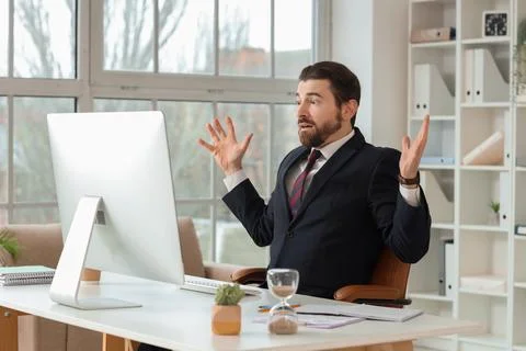 Stressed businessman reacting to computer problem in modern office, deadline  스톡 사진
