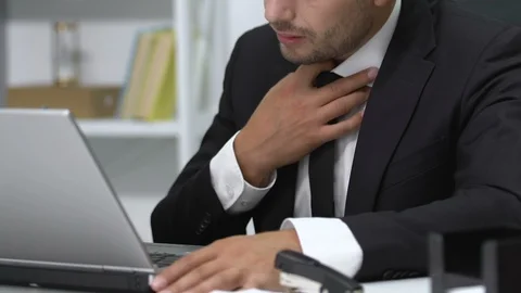 Stressed businessman reading e-mail on laptop, feeling asphyxia, bad news Stock-Footage 117379492