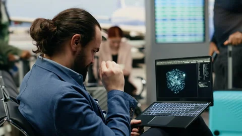 Stressed businessman using AI deep learning systems on laptop in airport lounge Stock Footage 339644099