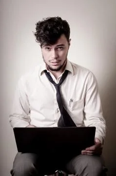 Stressed businessman using notebook Stock Photos