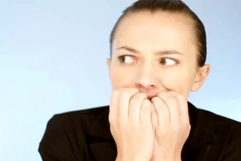 Stressed businesswoman biting her nails Stock Footage