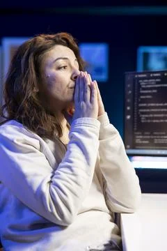 Stressed computer scientist praying to eliminate errors after applying patch Stock Photos