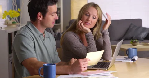 Stressed couple dealing with too many bills Stock-Footage 44480847