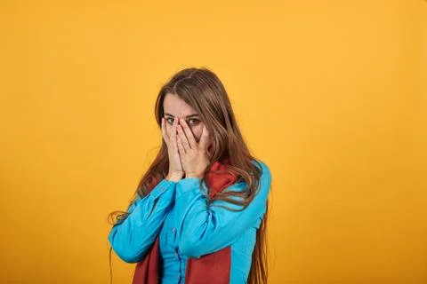 Stressed covered face with hands, crying feels desperate. Fear,shame, violence Foto stock