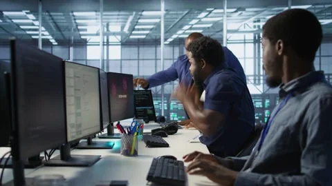 Stressed data center workers frightened after seeing performance drop Stock Footage 319540246