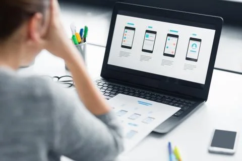 Stressed designer with user interface on laptop Foto stock