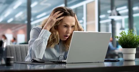 Stressed Doctor's Laptop Held Hostage In Cyber Ransomware Attack. Stock Photos