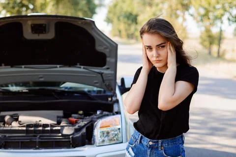 Stressed driver with a broken down car Stock Photos