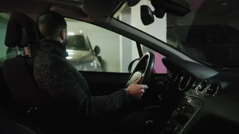 Stressed driver trying to put the safety belt on. Side view of a man in bad Stock Footage 232804156