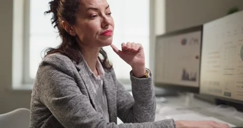 Stressed employee at office computer rubbing eyes from fatigue and workload Video stock 342030485
